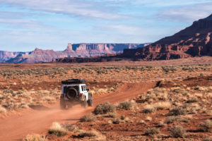 Jeep Wrangler JK driving down a dirt road near Moab Utah