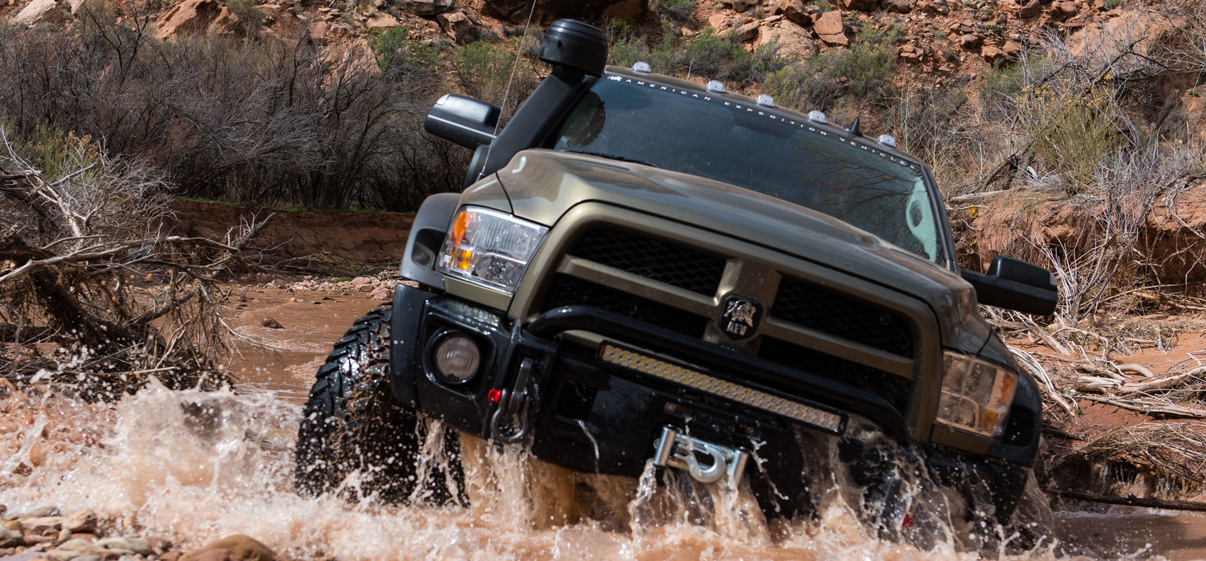 AEV DualSport Suspension overcoming an obstacle on AEV Prospector, based on the Ram heavy duty platform.