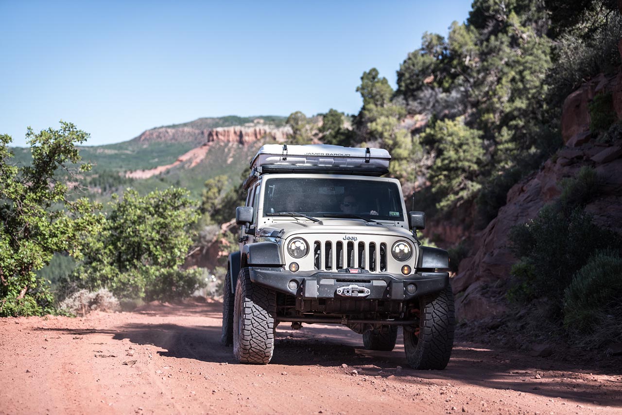 AEV Jeep parked in the shade.