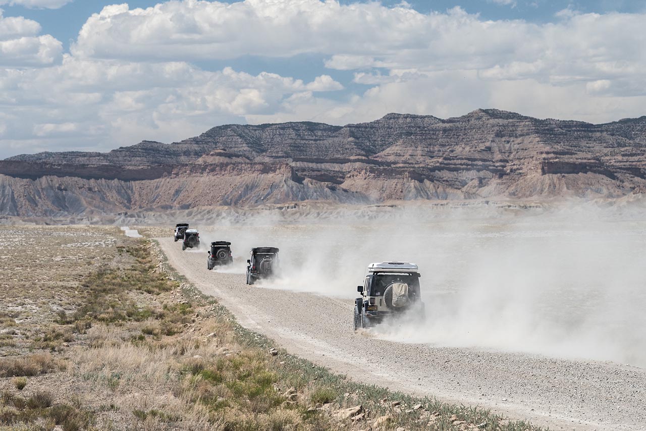 Group of Jeeps driving down the road